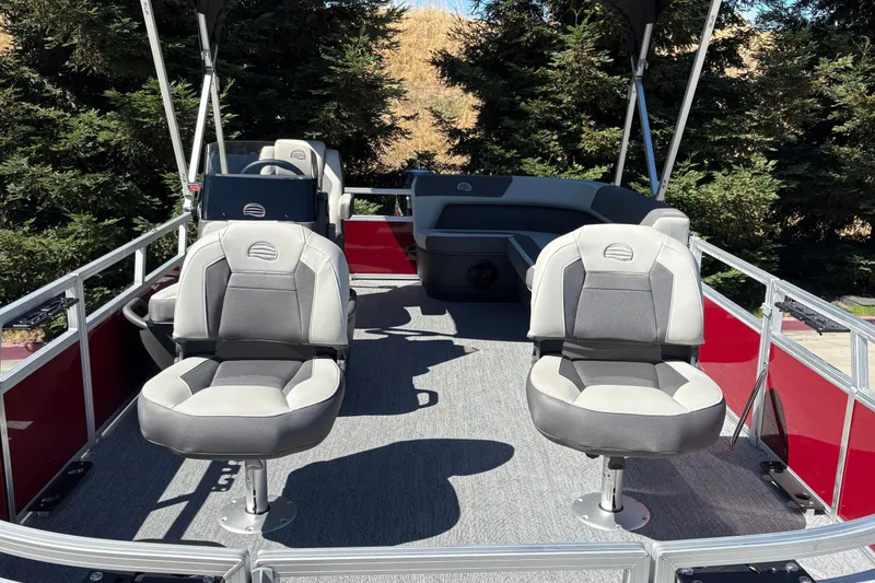 Slide: The Image of 2026 Sun Tracker Bass Buggy 16 XL Select pontoon boat with comfortable seating and spacious deck. - 16