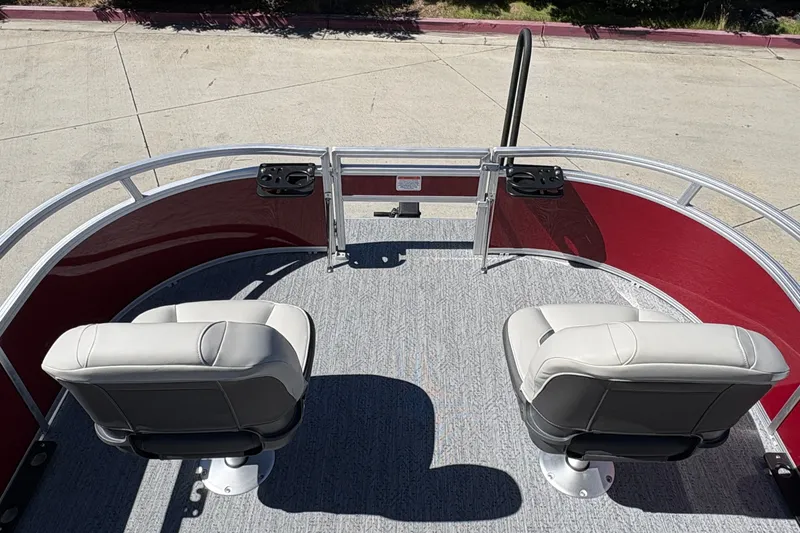 Slide: The Image of 2026 Sun Tracker Bass Buggy 16 XL Select pontoon boat with dual seats and red railing. - 20