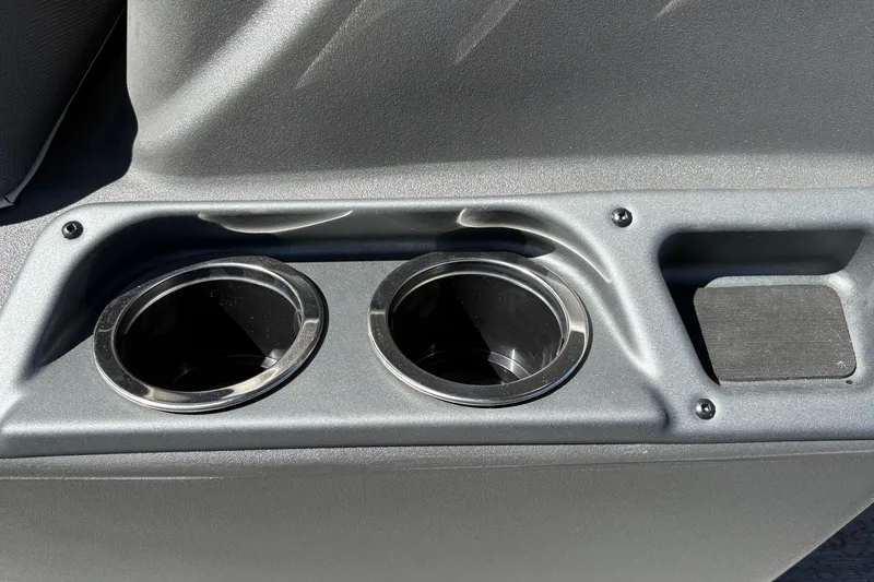 Slide: The Image of Cup holders on 2026 Sun Tracker Bass Buggy 16 XL Select boat console. - 38