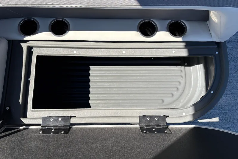 Slide: The Image of Open storage compartment on 2026 Sun Tracker Bass Buggy 16 XL Select boat. - 36