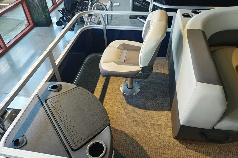 Slide: The Image of 2026 Sun Tracker Bass Buggy 18 DLX interior with seating and fishing station. - 11