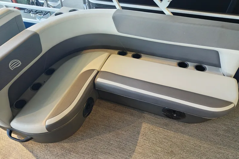 Slide: The Image of 2026 Sun Tracker Bass Buggy 18 DLX boat seating with cup holders and modern design. - 8