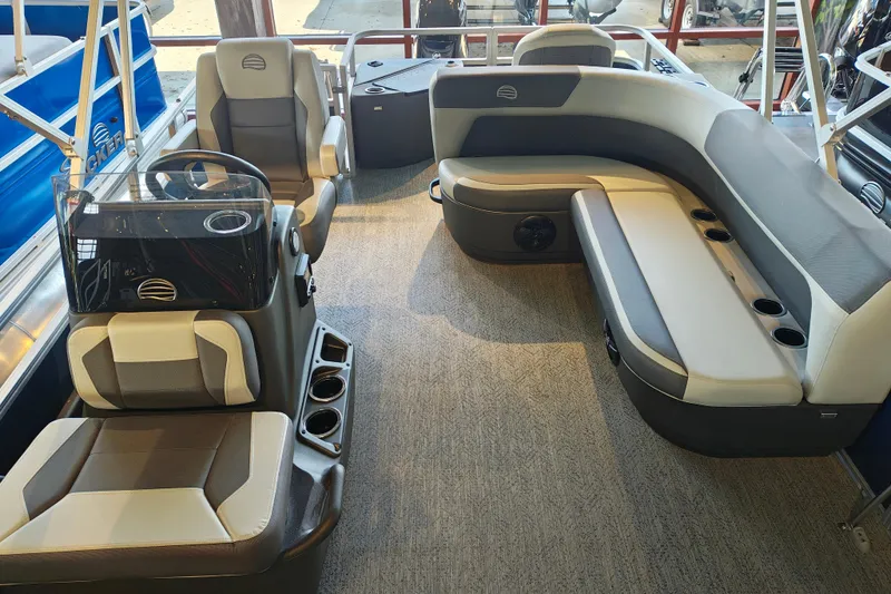 Slide: The Image of 2026 Sun Tracker Bass Buggy 18 DLX interior with seating and steering console. - 5