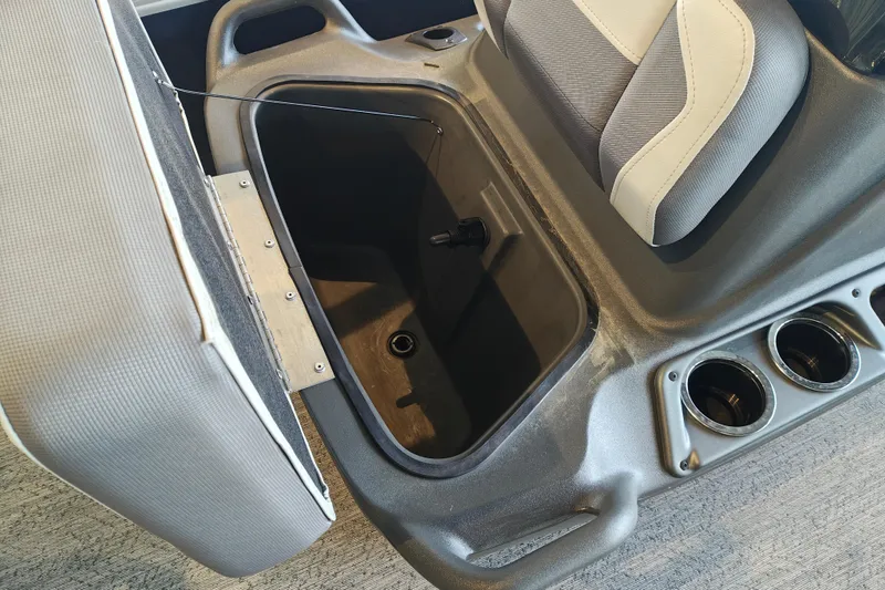 Slide: The Image of Sun Tracker Bass Buggy 18 DLX 2026 boat seat storage compartment with cup holders. - 6