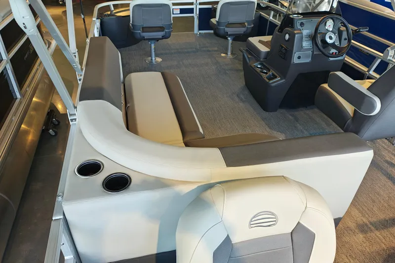 Slide: The Image of 2026 Sun Tracker Bass Buggy 18 DLX interior with seating and steering console. - 14