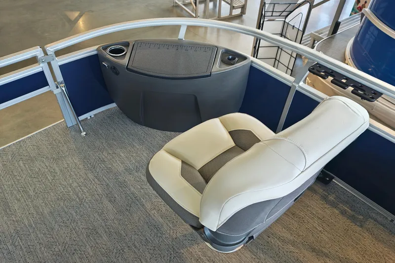 Slide: The Image of 2026 Sun Tracker Bass Buggy 18 DLX boat interior with comfortable seating and control panel. - 21