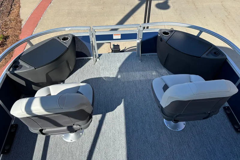 Slide: The Image of 2026 Sun Tracker Bass Buggy 18 DLX pontoon boat interior with seating and storage compartments. - 3
