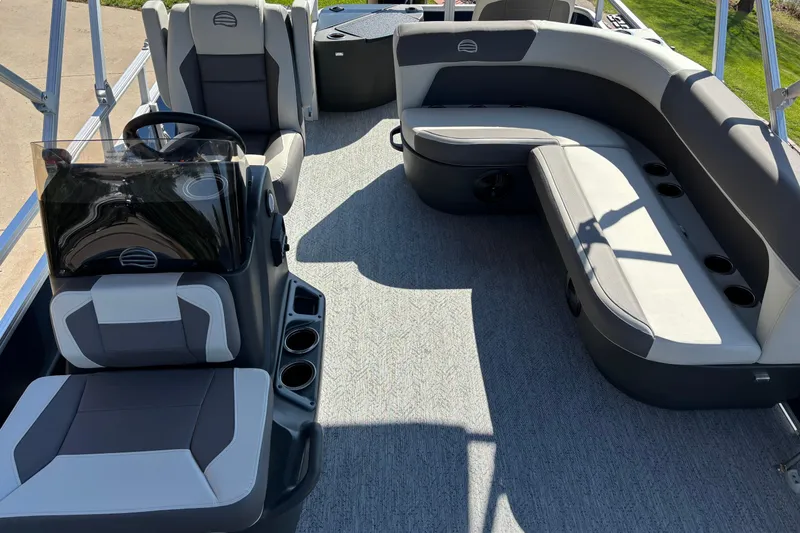 Slide: The Image of 2026 Sun Tracker Bass Buggy 18 DLX interior with seating and steering console. - 4