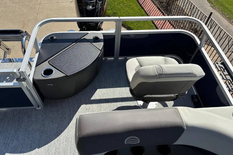 Slide: The Image of 2026 Sun Tracker Bass Buggy 18 DLX boat interior with seating and console. - 5