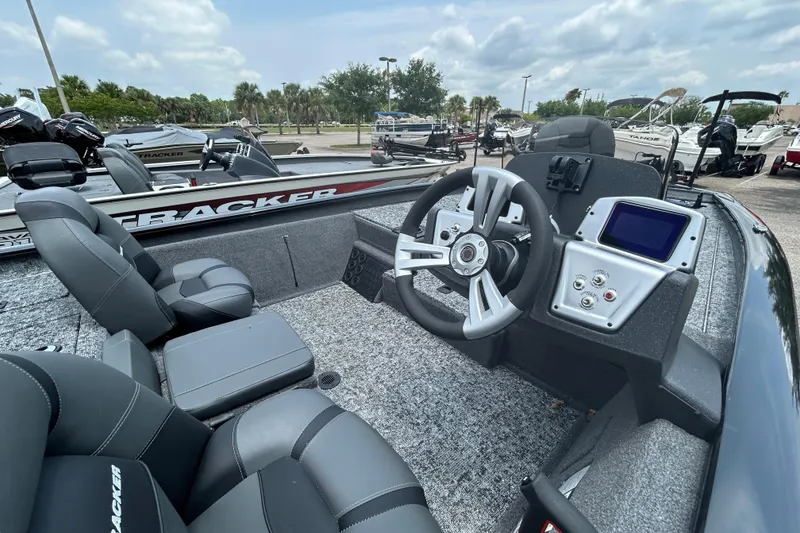 Slide: The Image of 2026 Tracker Pro Team 195 boat interior with steering wheel and dashboard display. - 5