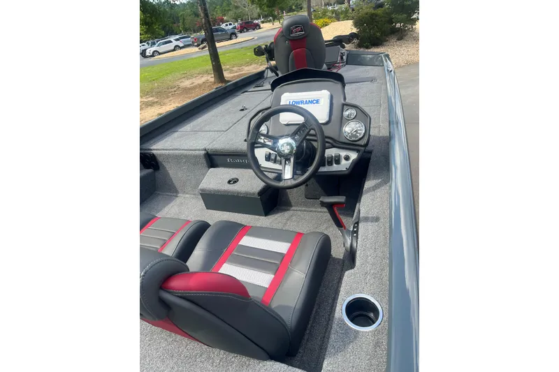 Slide: The Image of 2026 Ranger RT188P boat interior with steering wheel and Lowrance display. - 2