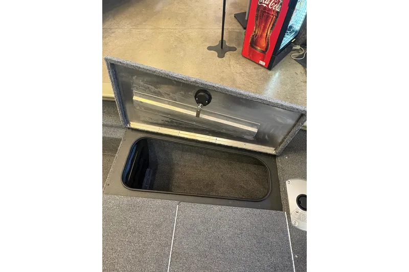 Slide: The Image of Open storage compartment in 2026 Tracker Pro Team 175 Crappie Edition boat. - 14