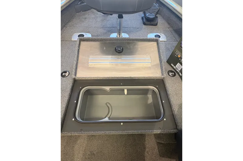 Slide: The Image of 2026 Tracker Pro Team 175 Crappie Edition boat interior with open storage compartment. - 13