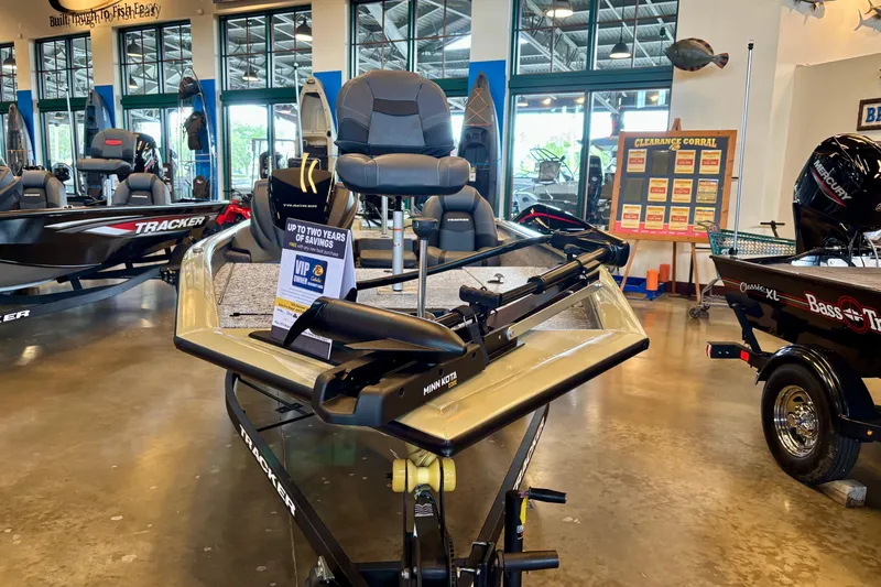 The Image of 2026 Tracker Pro Team 175 boat displayed in showroom with promotional signage. - 0