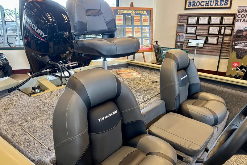 Slide: The Image of 2026 Tracker Pro Team 175 boat interior with Mercury engine, showroom display. - 3