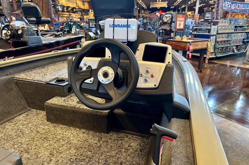 Slide: The Image of 2026 Tracker Pro Team 175 boat interior with steering wheel and control panel. - 4
