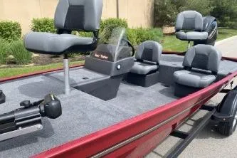 Slide: The Image of 2026 Tracker Bass Tracker Classic XL boat with seating and steering console. - 3