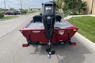 Slide: The Image of 2026 Tracker Bass Tracker Classic XL boat with 50 HP motor, parked outdoors. - 5