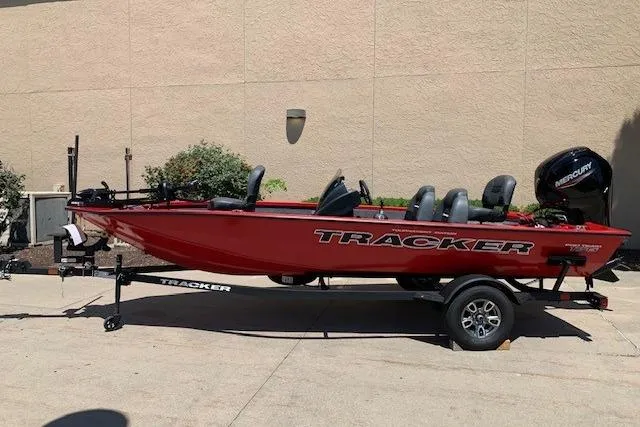 Slide: The Image of 2026 Tracker Pro Team 175 boat, red exterior, on trailer, parked outdoors. - 11