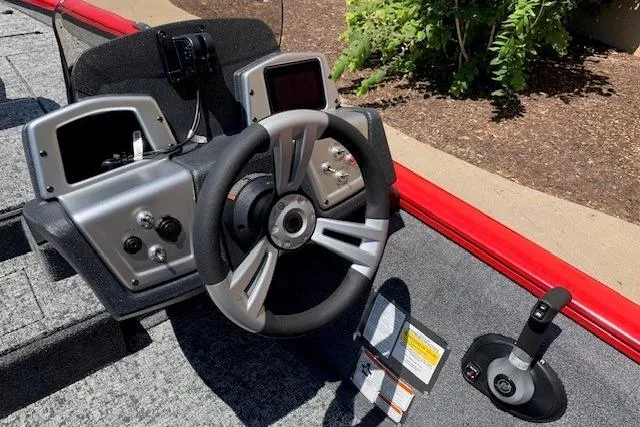 Slide: The Image of Steering console of 2026 Tracker Pro Team 175 boat with modern controls. - 19