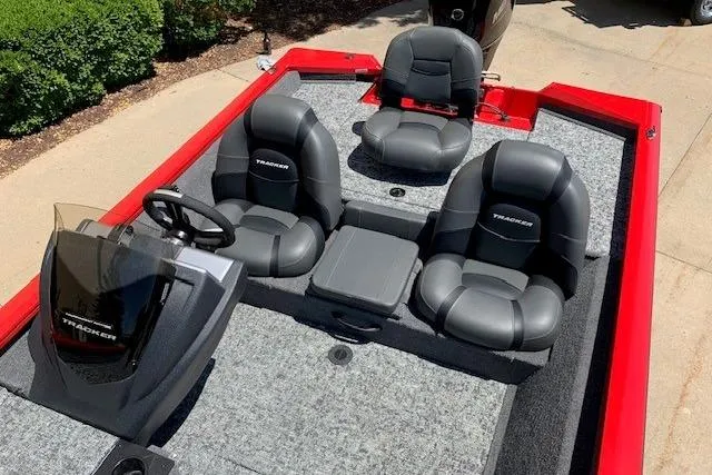 Slide: The Image of 2026 Tracker Pro Team 175 boat interior with gray seating and red accents. - 18