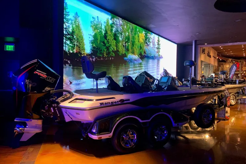 The Image of 2026 Ranger Z519R Cup-Equipped boat displayed indoors with scenic backdrop. - 0