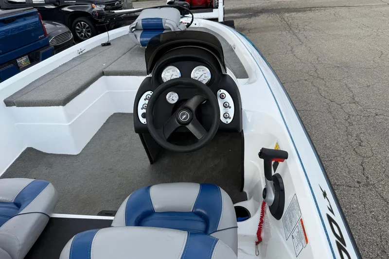 Slide: The Image of 2005 Nitro 700 LX SC boat interior with steering wheel and seating. - 3