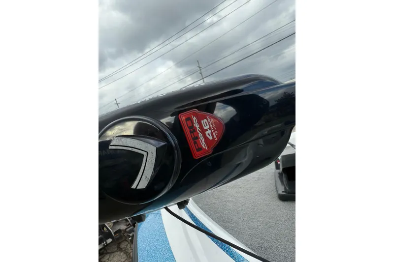 Slide: The Image of Close-up of a 2005 Nitro 700 LX SC boat detail with cloudy sky background. - 9