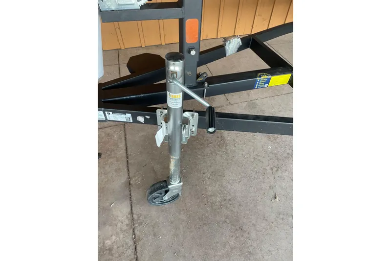 Slide: The Image of Trailer jack of a 2026 Reaper Boats 653 Timber Reaper on concrete surface. - 10