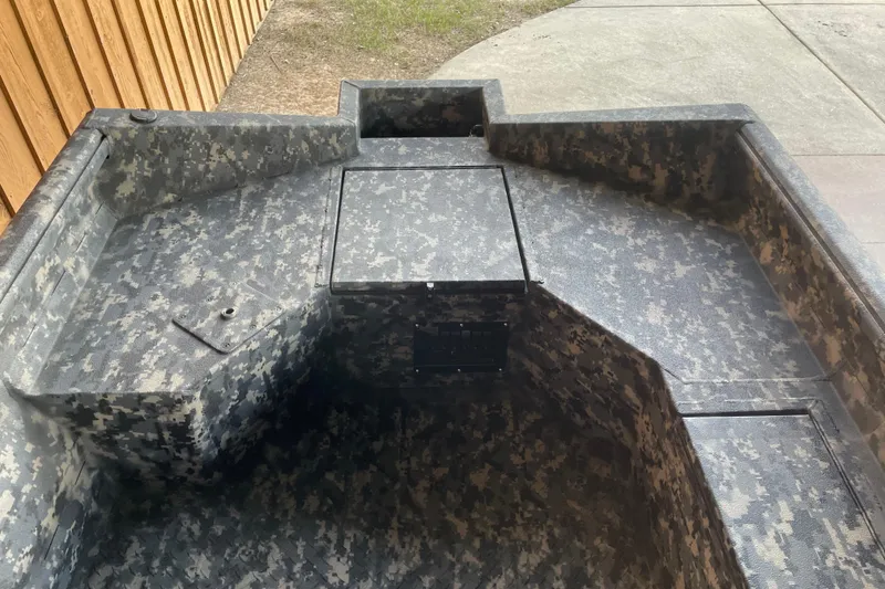 Slide: The Image of 2026 Reaper Boats 653 Timber Reaper interior with camouflage design. - 12