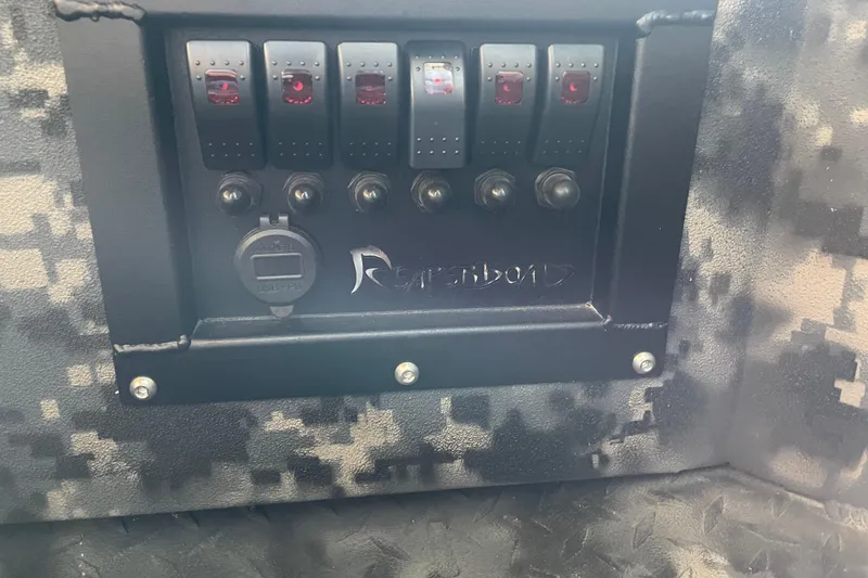 Slide: The Image of Control panel of 2026 Reaper Boats 653 Timber Reaper with camouflage design. - 13