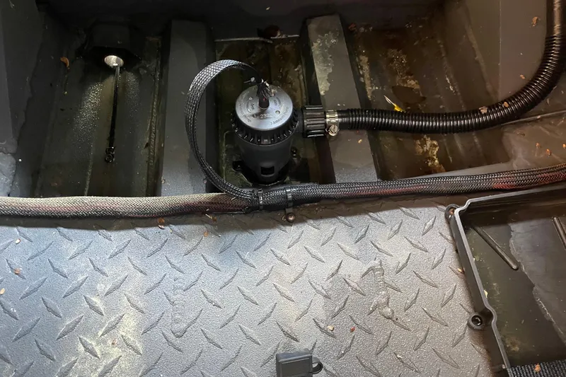 Slide: The Image of Interior view of 2026 Reaper Boats 653 Timber Reaper showing bilge pump and wiring. - 15