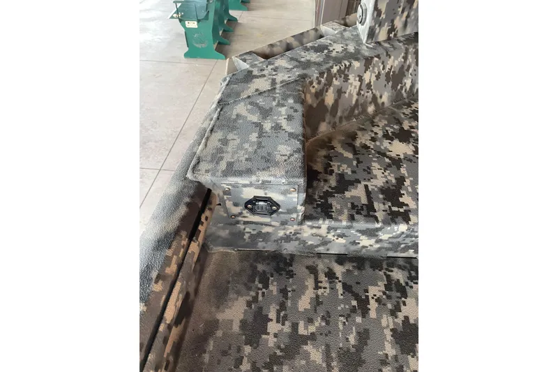 Slide: The Image of 2026 Reaper Boats 653 Timber Reaper interior with camouflage pattern and utility socket. - 16