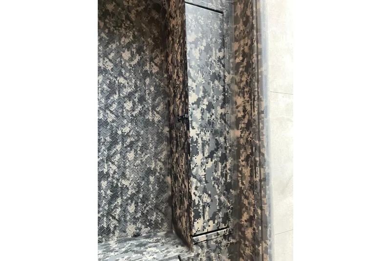 Slide: The Image of 2026 Reaper Boats 653 Timber Reaper with camouflage interior design. - 3