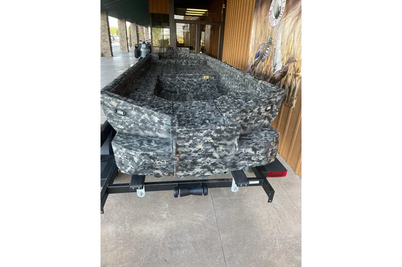 Slide: The Image of 2026 Reaper Boats 653 Timber Reaper with camouflage design on display. - 7