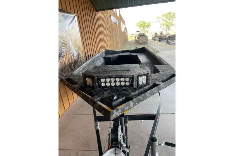 Slide: The Image of 2026 Reaper Boats 653 Timber Reaper with LED lights on display. - 8