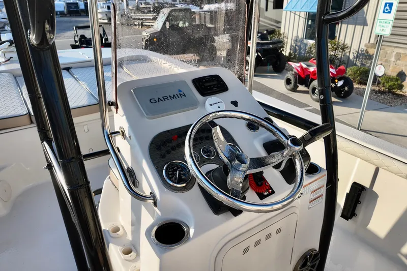 Slide: The Image of 2020 Carolina Skiff 21 LS boat console with Garmin navigation system and steering wheel. - 5