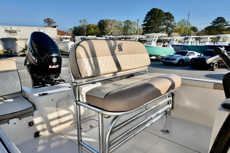 Slide: The Image of 2020 Carolina Skiff 21 LS boat with Suzuki 140 engine, featuring comfortable seating. - 9