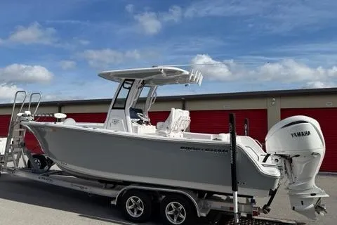 Slide: The Image of 2024 Sportsman Heritage 231 Center Console boat on trailer, featuring Yamaha outboard motor. - 10