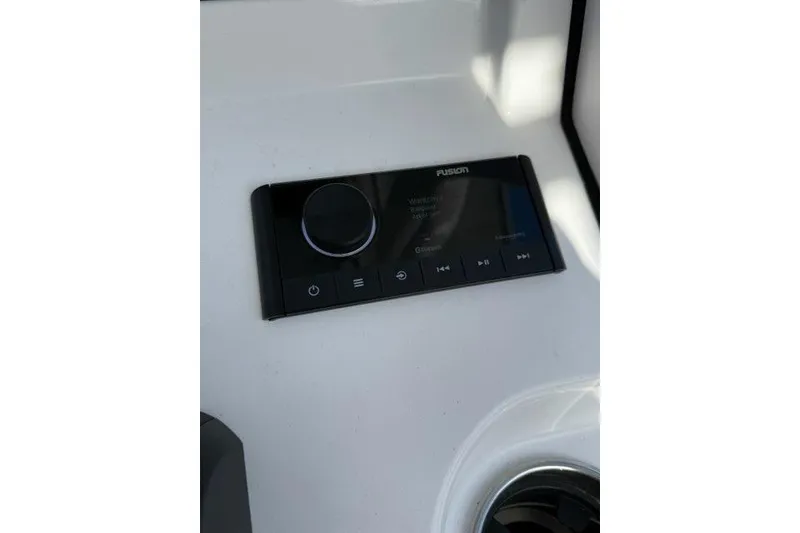 Slide: The Image of Fusion audio system on 2024 Sportsman Heritage 231 Center Console boat dashboard. - 17