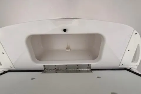 Slide: The Image of 2024 Sportsman Heritage 231 Center Console storage compartment detail. - 18