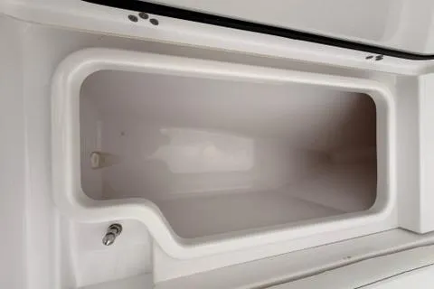 Slide: The Image of 2024 Sportsman Heritage 231 Center Console storage compartment, spacious and sleek design. - 20