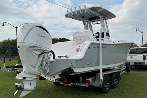 Slide: The Image of 2024 Sportsman Heritage 231 Center Console boat on trailer, featuring Yamaha outboard motor. - 3
