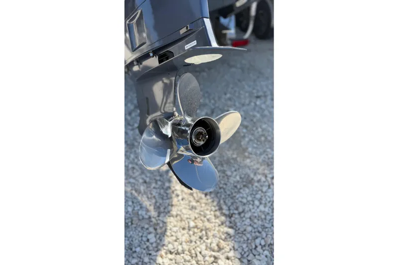 Slide: The Image of 2024 Ranger Tugs R-27 boat propeller on gravel surface. - 28