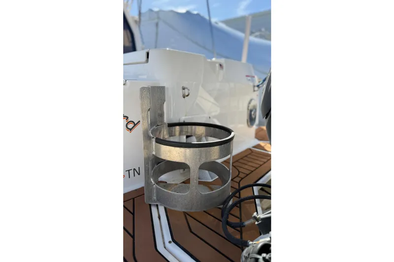 Slide: The Image of 2024 Ranger Tugs R-27 boat detail with metal holder on deck. - 29