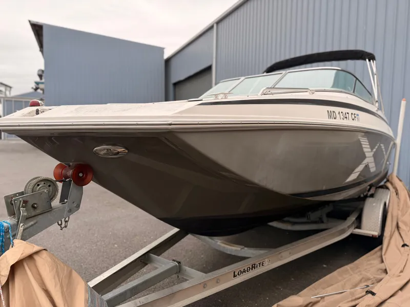 Slide: The Image of 2013 Regal 24 FasDeck boat parked on trailer. - 10