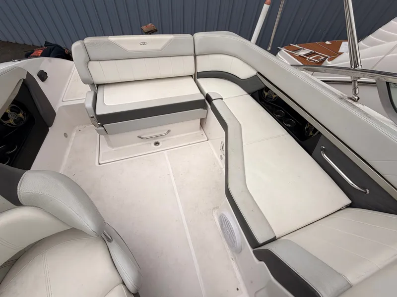 Slide: The Image of Interior of a 2013 Regal 24 FasDeck boat with white upholstery. - 14