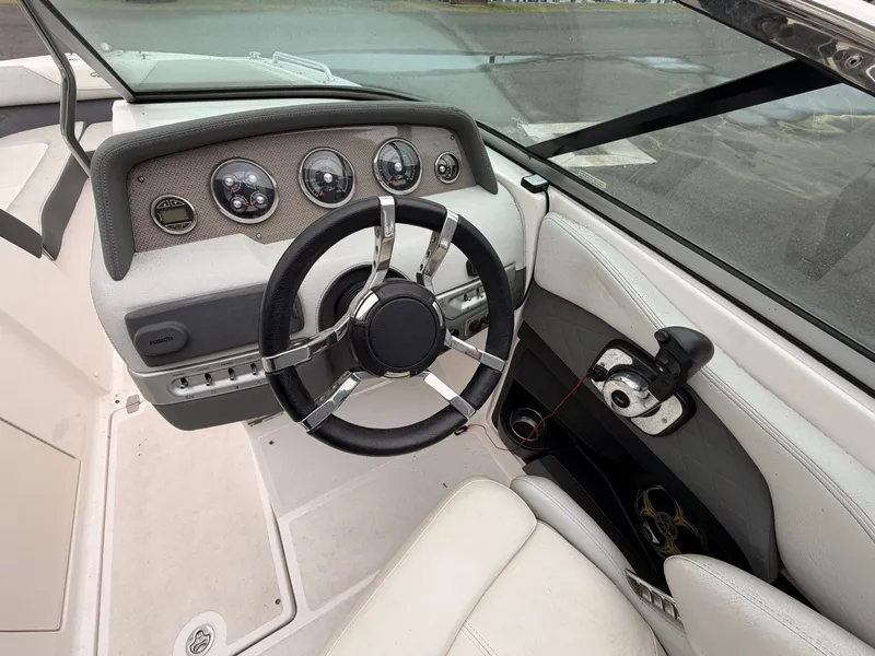 Slide: The Image of Cockpit of a 2013 Regal 24 FasDeck boat. - 15