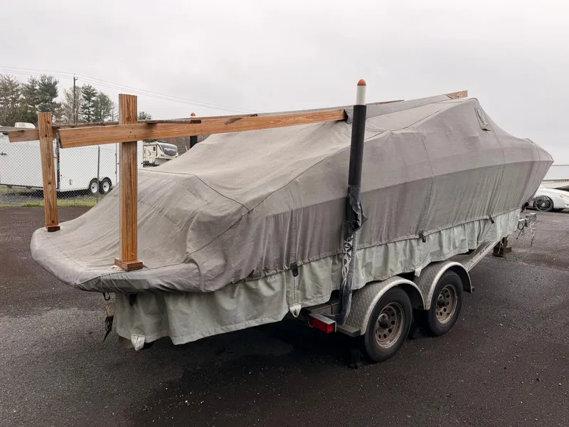 Slide: The Image of 2013 Regal 24 FasDeck boat covered on trailer. - 20