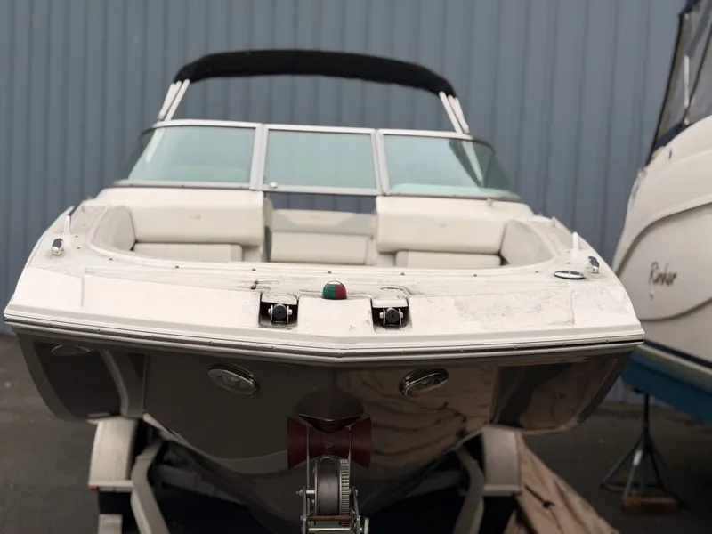 Slide: The Image of 2013 Regal 24 FasDeck boat on trailer in front of warehouse. - 8